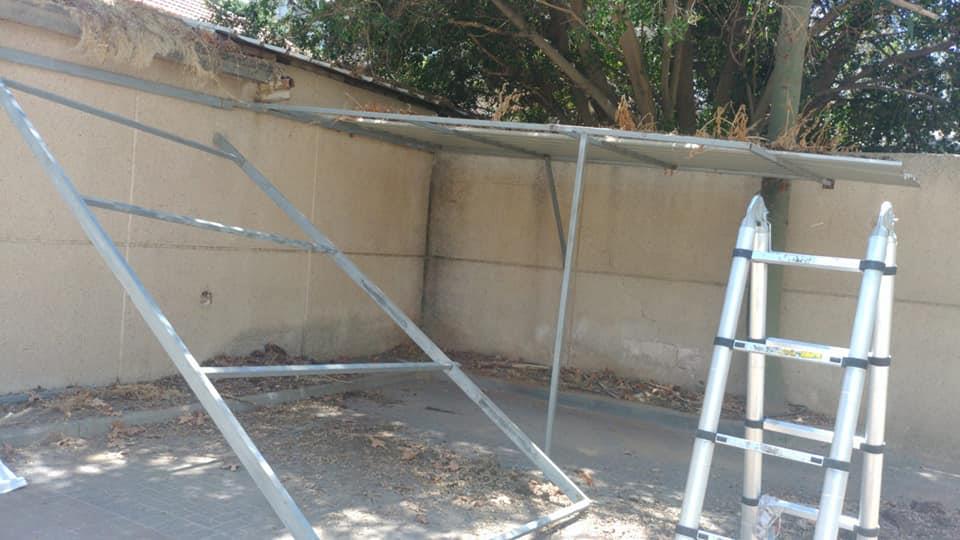 פירוק ופינוי של גגון חניה כפולה